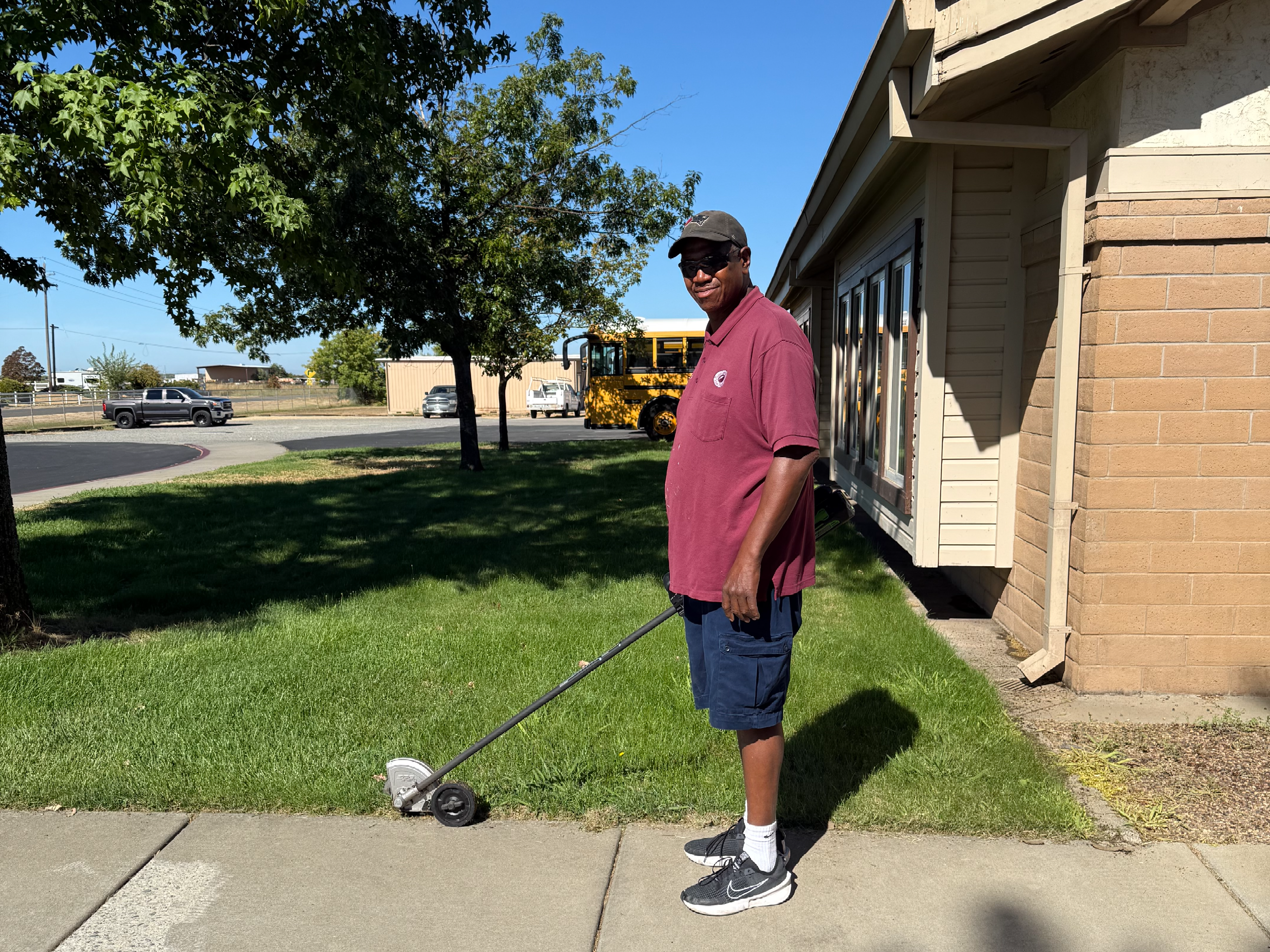 Lonnie trimming the lawn 